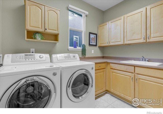 2841 Silver Pl, Superior, CO 80027 - laundry area with washer and clothes dryer, cabinet space, and light tile patterned floors