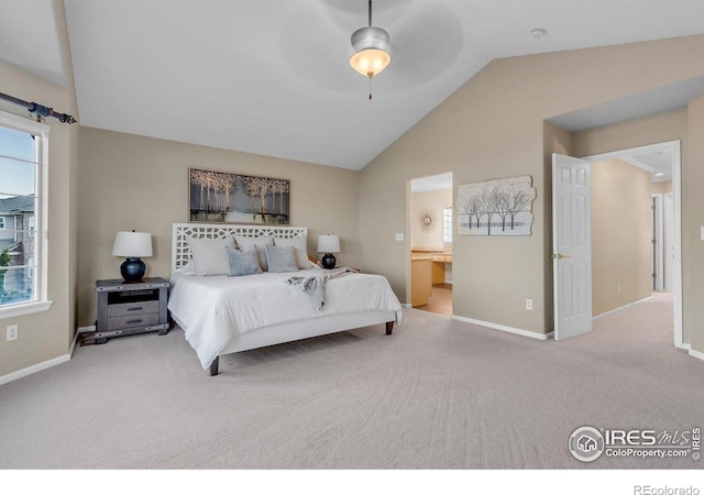 2841 Silver Pl, Superior, CO 80027 - carpeted bedroom featuring vaulted ceiling, baseboards, multiple windows, connected bathroom, and ceiling fan