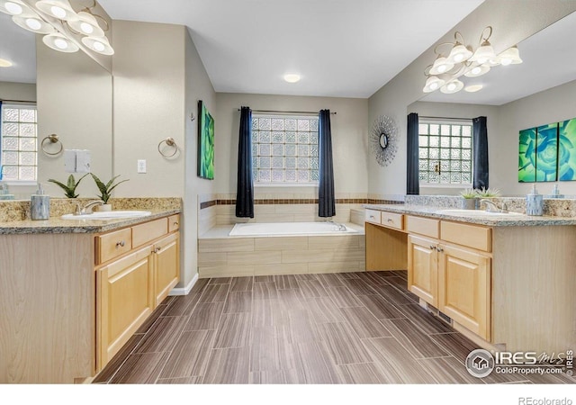 2841 Silver Pl, Superior, CO 80027 - full bathroom featuring a garden tub and two vanities