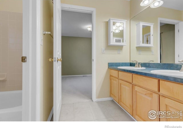 2841 Silver Pl, Superior, CO 80027 - bathroom featuring double vanity, tile patterned flooring, baseboards, and shower / bath combination