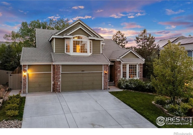 2841 Silver Pl, Superior, CO 80027 - traditional home with brick siding, a garage, and concrete driveway