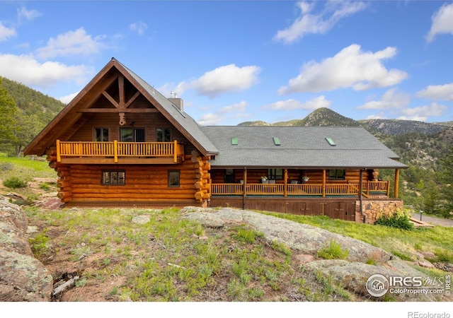 95 Choctaw Rd, Lyons, CO 80540 - rear view of property featuring log siding and a mountain view