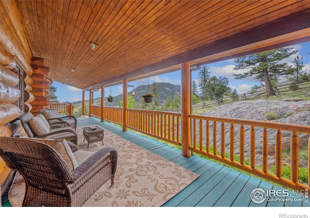 95 Choctaw Rd, Lyons, CO 80540 - wooden terrace featuring a mountain view and an outdoor hangout area