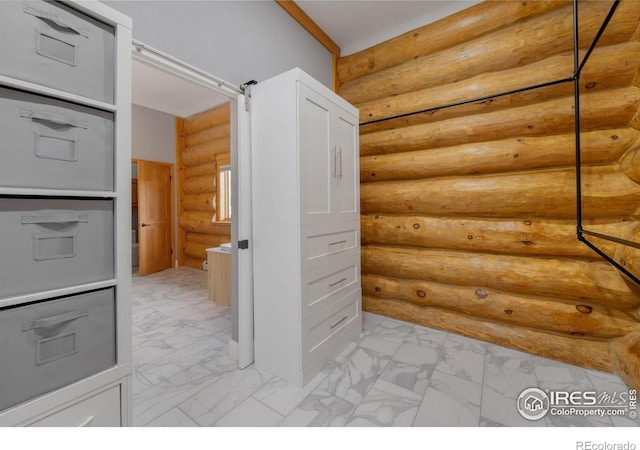 95 Choctaw Rd, Lyons, CO 80540 - hall featuring light marble finish flooring and rustic walls