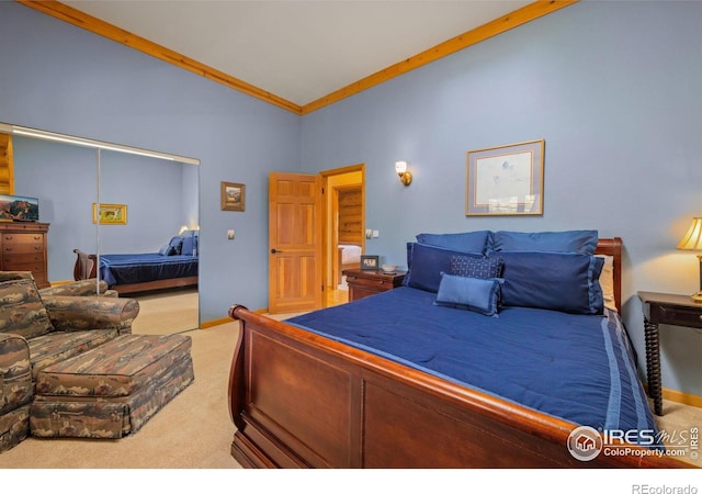 95 Choctaw Rd, Lyons, CO 80540 - bedroom featuring carpet flooring, a closet, crown molding, and baseboards