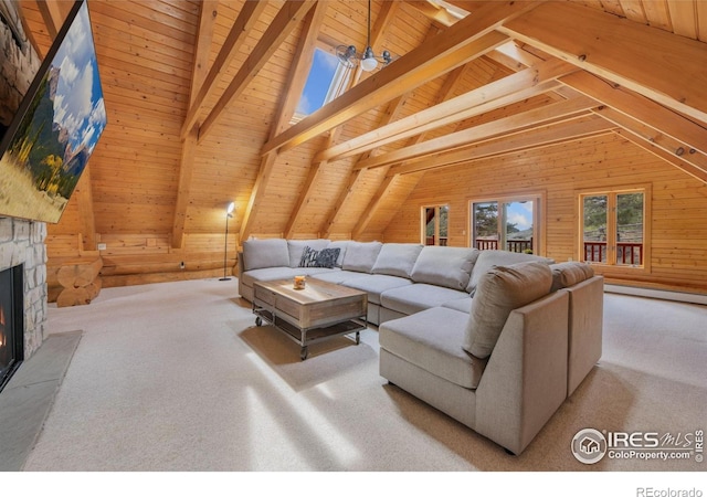 95 Choctaw Rd, Lyons, CO 80540 - carpeted living room featuring wooden walls, wooden ceiling, a baseboard radiator, and a stone fireplace