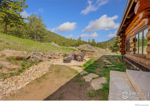 95 Choctaw Rd, Lyons, CO 80540 - view of yard with a patio area, a mountain view, and a fire pit