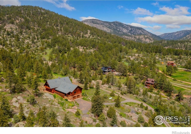 95 Choctaw Rd, Lyons, CO 80540 - view from above of property with a heavily wooded area and a mountainous background