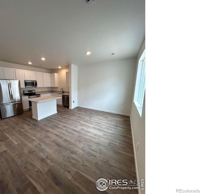 420 Condor Way, Johnstown, CO 80534 - kitchen featuring stainless steel appliances, a sink, recessed lighting, open floor plan, and a center island