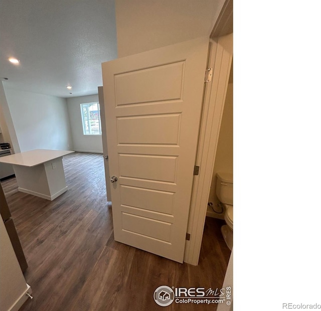 420 Condor Way, Johnstown, CO 80534 - hallway featuring dark wood-type flooring, baseboards, and recessed lighting