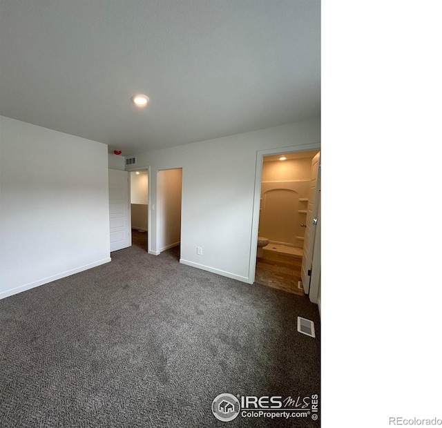 420 Condor Way, Johnstown, CO 80534 - unfurnished bedroom featuring baseboards, dark carpet, recessed lighting, and connected bathroom