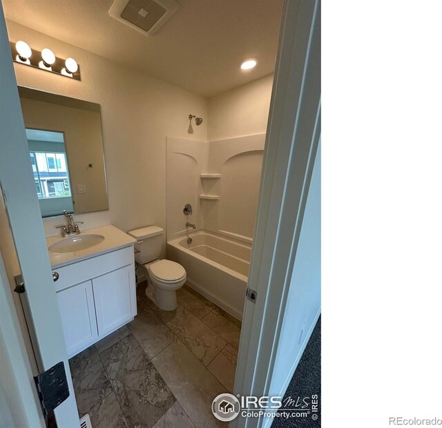 420 Condor Way, Johnstown, CO 80534 - full bathroom featuring toilet, vanity, washtub / shower combination, marble look tiles, and recessed lighting