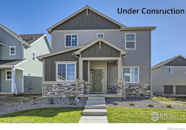 1875 Foggy Brook Dr, Fort Collins, CO 80528 - craftsman house featuring board and batten siding, stone siding, and a front yard