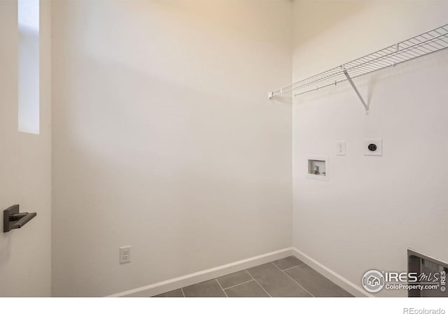 1875 Foggy Brook Dr, Fort Collins, CO 80528 - laundry area with hookup for a washing machine, electric dryer hookup, baseboards, and dark tile patterned flooring