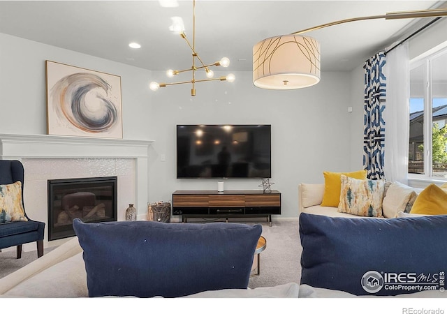 6229 Black Mesa Rd, Frederick, CO 80516 - living room featuring carpet flooring, a chandelier, and a tile fireplace
