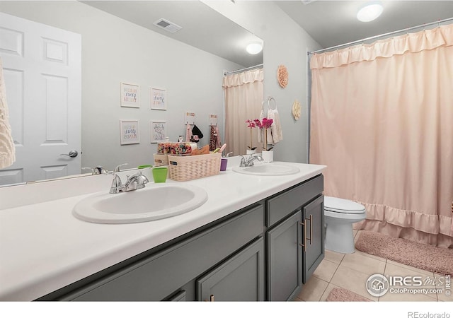 6229 Black Mesa Rd, Frederick, CO 80516 - full bath with tile patterned flooring, double vanity, toilet, and curtained shower