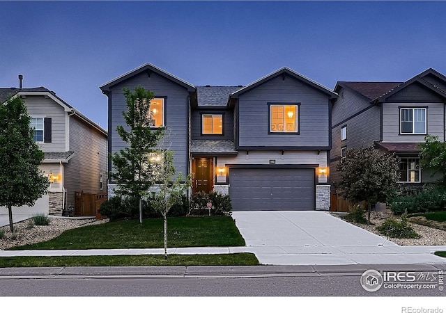 6229 Black Mesa Rd, Frederick, CO 80516 - view of front of property with concrete driveway, a garage, and a front lawn