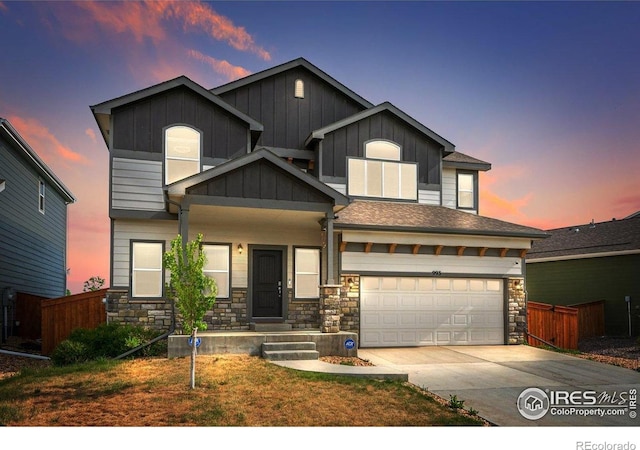 993 Ouzel Falls Rd, Severance, CO 80550 - craftsman-style home with stone siding, driveway, and board and batten siding