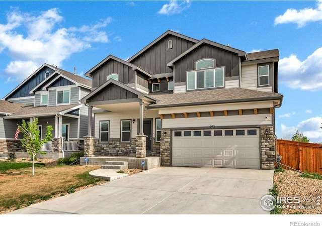 993 Ouzel Falls Rd, Severance, CO 80550 - craftsman-style home featuring board and batten siding, concrete driveway, an attached garage, and stone siding