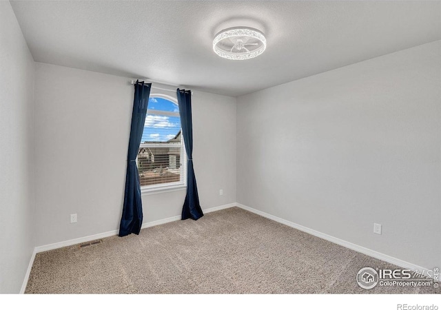 993 Ouzel Falls Rd, Severance, CO 80550 - carpeted empty room featuring baseboards and a textured ceiling