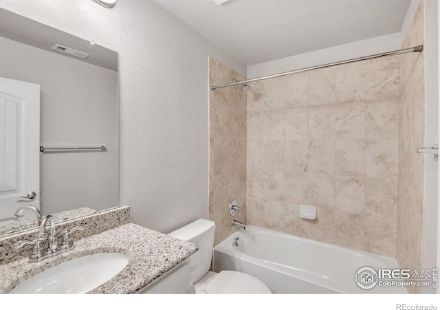 993 Ouzel Falls Rd, Severance, CO 80550 - bathroom featuring toilet, vanity, a textured wall, and shower / washtub combination