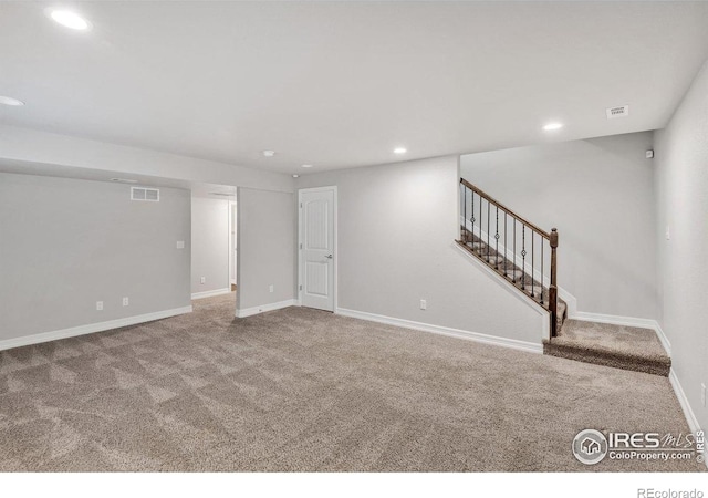 993 Ouzel Falls Rd, Severance, CO 80550 - below grade area with carpet flooring, recessed lighting, stairway, and baseboards