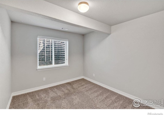 993 Ouzel Falls Rd, Severance, CO 80550 - carpeted empty room with baseboards and a textured ceiling