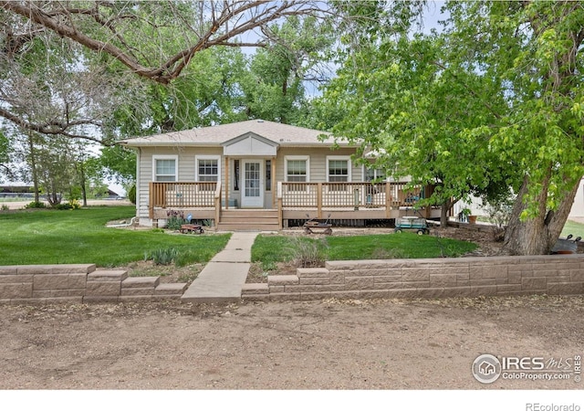 23462 County Road 55, Kersey, CO 80644 - view of front of home with a front yard and a wooden deck
