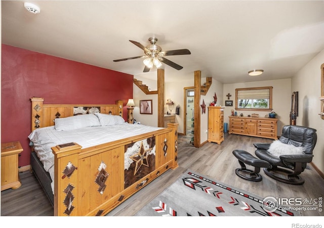 23462 County Road 55, Kersey, CO 80644 - bedroom featuring wood finished floors, a ceiling fan, and baseboards