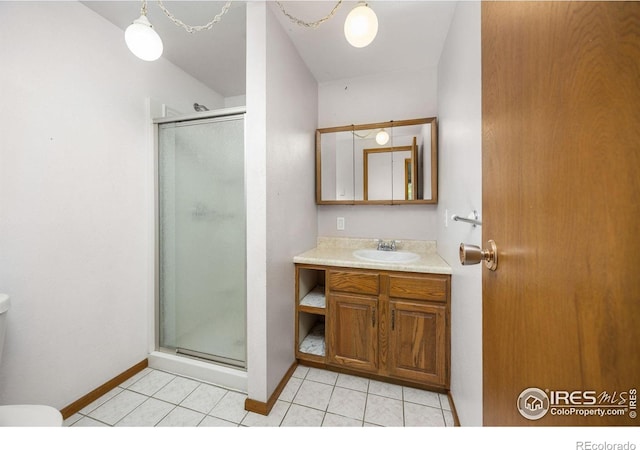 23462 County Road 55, Kersey, CO 80644 - full bath with toilet, a stall shower, vanity, baseboards, and tile patterned flooring