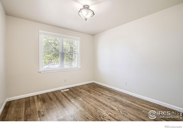 520 N Harding Ave, Johnstown, CO 80534 - spare room with baseboards and wood finished floors