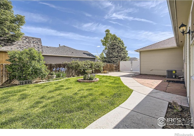 520 N Harding Ave, Johnstown, CO 80534 - view of yard featuring a patio area and central AC