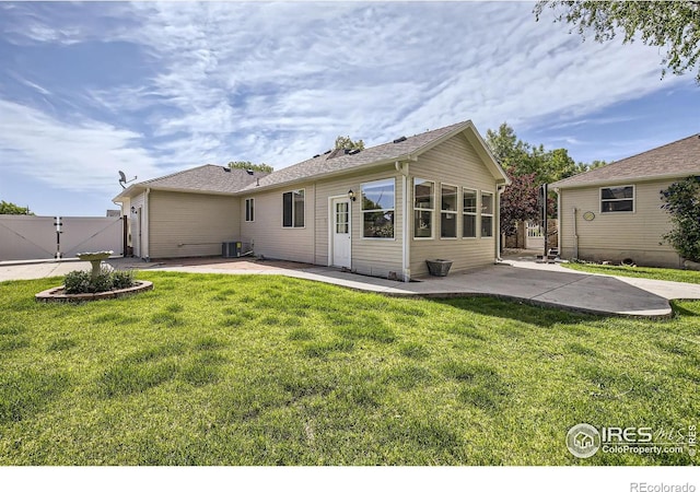 520 N Harding Ave, Johnstown, CO 80534 - rear view of house featuring a patio, a gate, and cooling unit