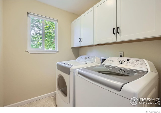 520 N Harding Ave, Johnstown, CO 80534 - washroom with cabinet space, washer and dryer, and baseboards