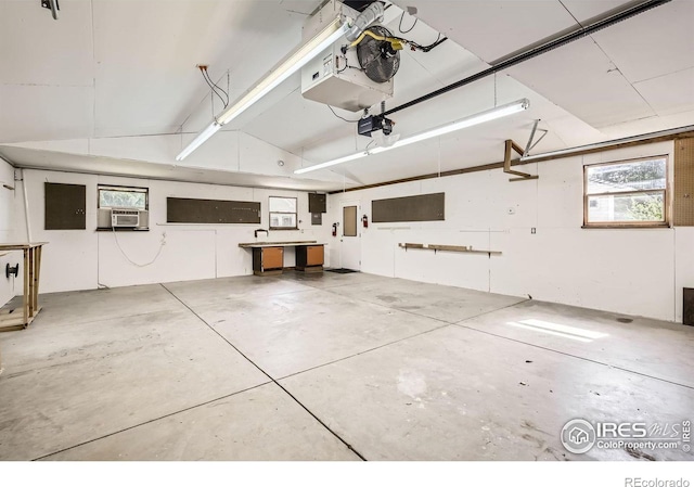 520 N Harding Ave, Johnstown, CO 80534 - garage featuring cooling unit and a garage door opener