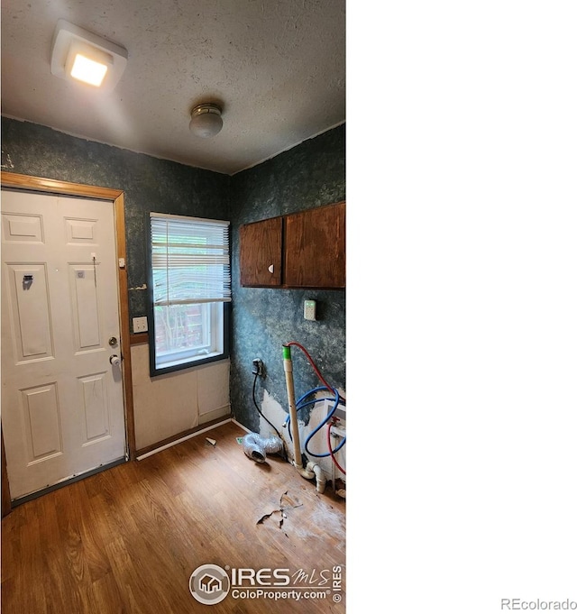 305 Phelps St, Sterling, CO 80751 - home office with wood finished floors and a textured ceiling