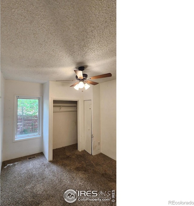 305 Phelps St, Sterling, CO 80751 - unfurnished bedroom with carpet, a textured ceiling, a closet, and a ceiling fan
