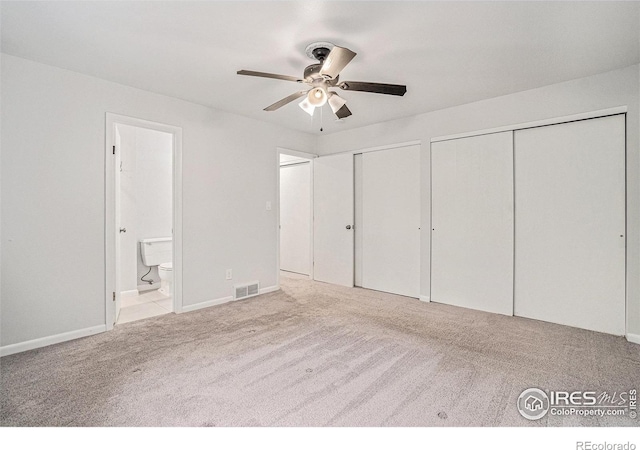 2824 Edinburgh Ct, Fort Collins, CO 80525 - unfurnished bedroom with carpet flooring, two closets, ensuite bathroom, baseboards, and a ceiling fan