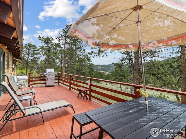 839 Ski Rd, Allenspark, CO 80510 - wooden terrace with a grill and a mountain view