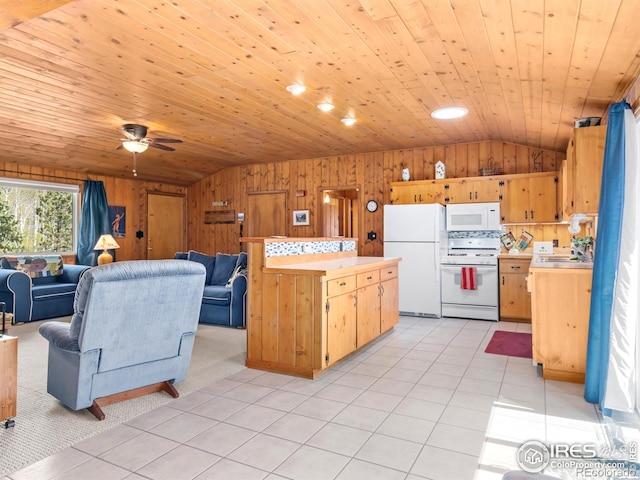 839 Ski Rd, Allenspark, CO 80510 - kitchen with white appliances, vaulted ceiling, light countertops, wood walls, and open floor plan