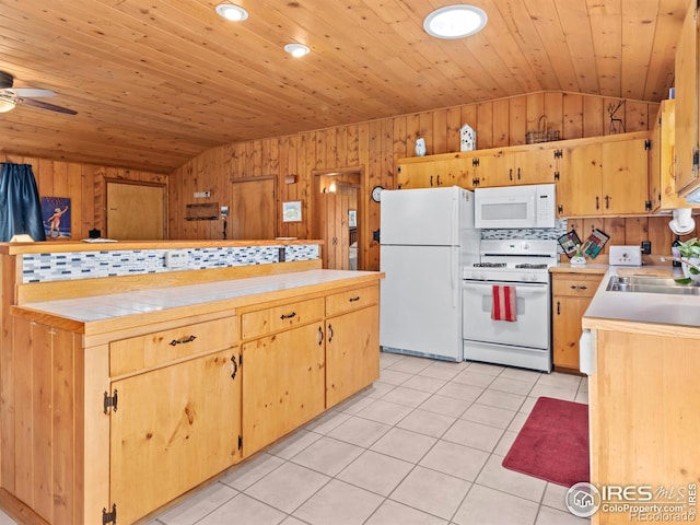 839 Ski Rd, Allenspark, CO 80510 - kitchen featuring white appliances, lofted ceiling, light tile patterned floors, light countertops, and a sink