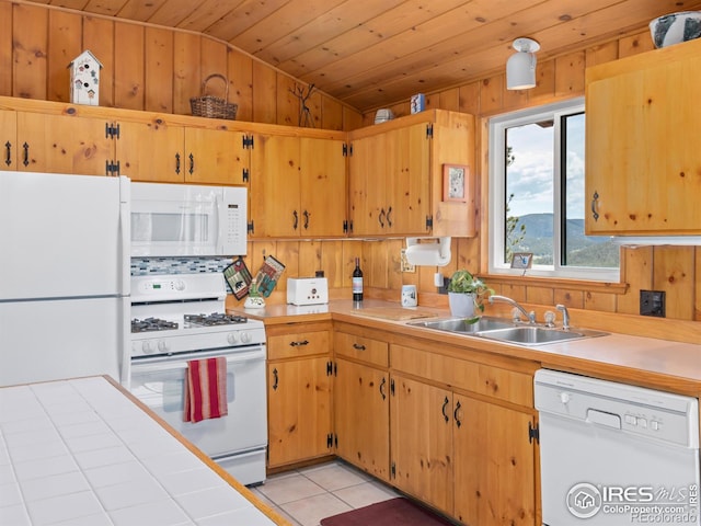 839 Ski Rd, Allenspark, CO 80510 - kitchen with white appliances, a sink, vaulted ceiling, wooden ceiling, and light tile patterned floors