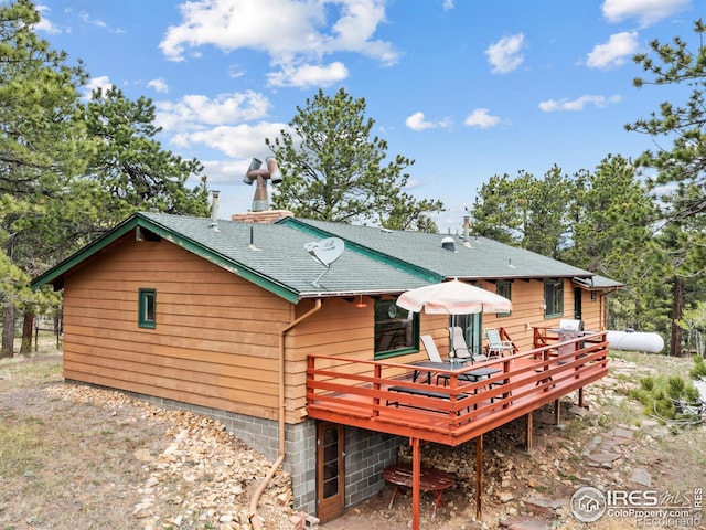 839 Ski Rd, Allenspark, CO 80510 - back of property featuring a deck and a shingled roof