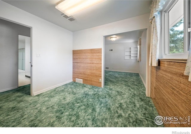 201 Howard St, Brush, CO 80723 - carpeted empty room featuring baseboards