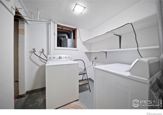 201 Howard St, Brush, CO 80723 - washroom with washing machine and dryer and baseboards