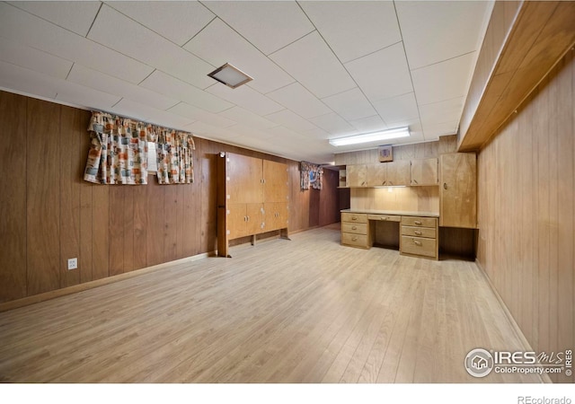 201 Howard St, Brush, CO 80723 - finished below grade area featuring light wood-type flooring and wood walls