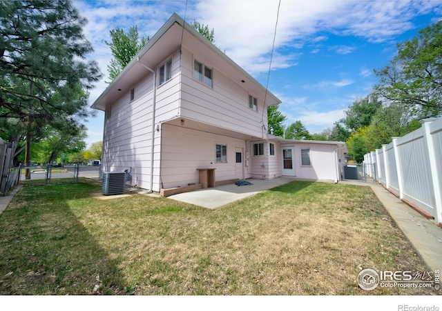 201 Howard St, Brush, CO 80723 - rear view of property with a patio, a gate, and cooling unit