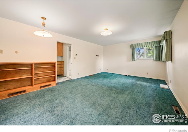 201 Howard St, Brush, CO 80723 - unfurnished room with dark carpet and baseboards