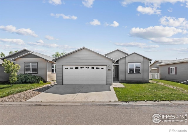 6150 Bluestem Grn, Frederick, CO 80530 - ranch-style home featuring driveway, an attached garage, and a front lawn