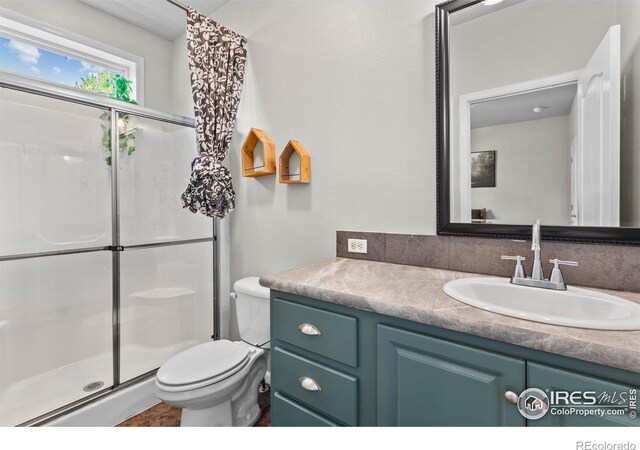6150 Bluestem Grn, Frederick, CO 80530 - bathroom with a shower stall, vanity, and toilet